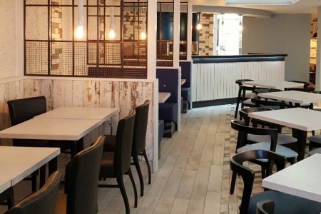 Prezzo, Chippenham - blue chairs and white tables, white wooden cladding, booth seating