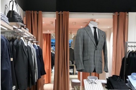 Reiss, Canary Wharf - fitting room curtains with suits in front