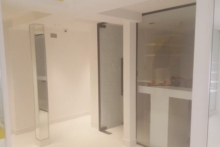 Modern mirror column feature, large partition wall with window