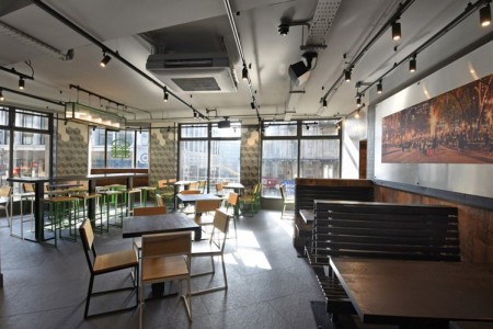 Shake Shack, Leicester Square - seating area with benches, tables and chairs