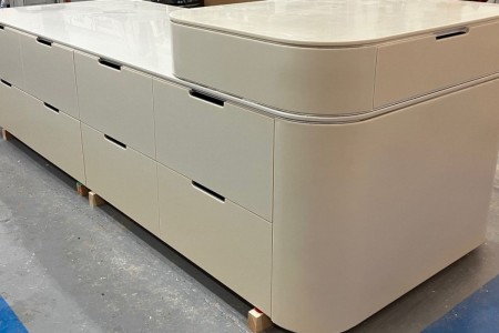 This mid floor unit made of High Macs, a solid surface material, which creates a seamless, sleek finish is completed and ready to go to a high-end retailer in Knightsbridge