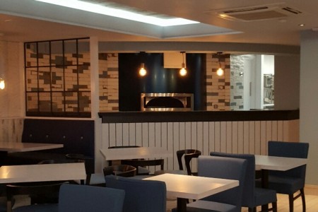 Prezzo, Chippenham - blue chairs and white tables, distressed tiling, white wooden cladding