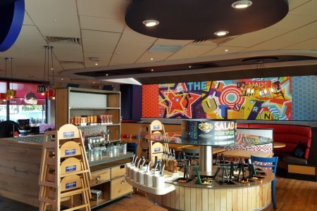 Pizza Hut, Stevenage - graffiti-style wall art, salad bar with bespoke wooden cladding in front of it
