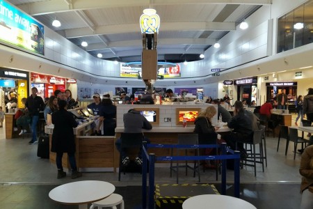 Auntie Anne's Luton Airport showing the brick and wooden central counters and unique central totem