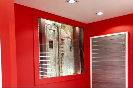 Le Creuset, St Albans - bright red wall with bespoke wooden displays