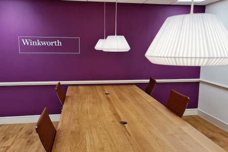 Winkworth Estate Agents, Crystal Palace - close up of large table and purple wall behind