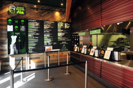 Shake Shack, New Oxford Street, London - till area with menu on wooden clad wall