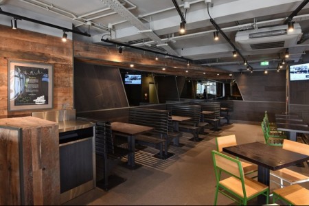 Shake Shack, Leicester Square - wooden tables and chairs, wooden cladding on walls