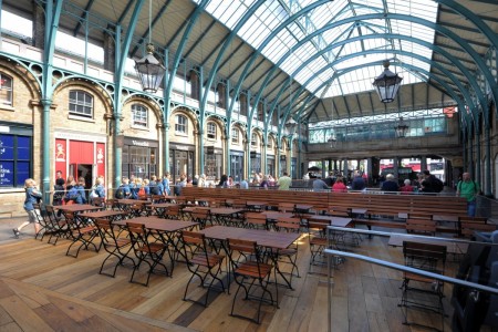 Shake Shack, Covent Garden - exterior seating area with wooden chairs and tables