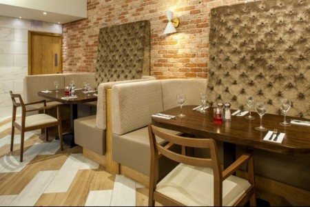 Prezzo, Abergavenny - dark wooden tables and chairs, brick walls, booth seating