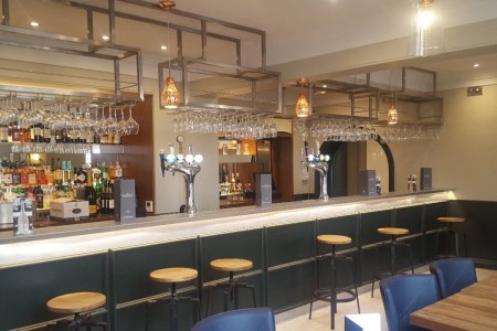 The Chequers Hotel, Newbury - bar area with wooden stools, chrome fittings, wooden tables