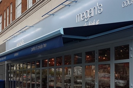 Megan's, Kensington - exterior close up of signage, blue and white branding