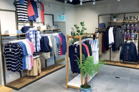 Joules, Longford, Ireland - wooden structure clothing displays, grey tiled floor, mens clothing