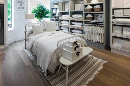 The White Company, Norwich - white linen on double bed, hardwood flooring