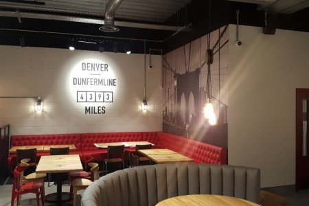 Smashburger, Dunfermline - white walls with bridge graphic, red leather booth seating, grey circular booth seating