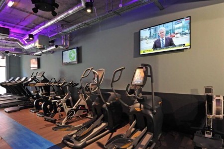Commercial Shopfittings in London, exercise machines, tv, wooden floor