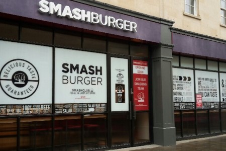 Smashburger, Bath - exterior with window graphics and white logo on purple 