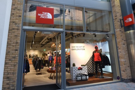 The North Face, Chelmsford - shopfront with brick and glass windows, red and white branding above door