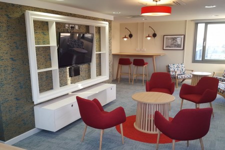 The common room area in Astor House, with its bespoke installation from Oakwoods