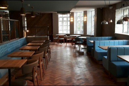 Wildwood, Bournemouth - blue leather bench seating, parquet flooring, wooden chairs