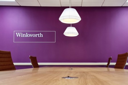 Winkworth Estate Agents, Crystal Palace - close up of large table and purple wall behind