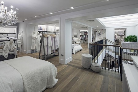 The White Company, Norwich - hardwood flooring, white bed linen, white painted walls and downlights 