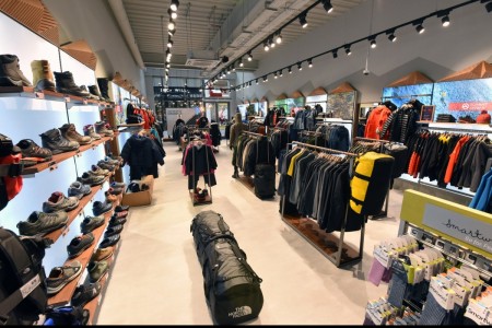 The North Face, Chelmsford - walking boot display on wall with backlight, clothing displays around it