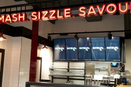 Smashburger, Bath - neon signs, white tiles and kitchen area with glassware