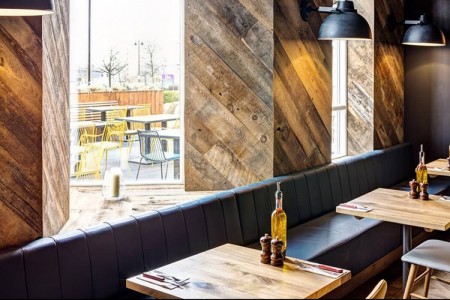 Wildwood, Braintree - wooden styling around windows, wooden tables and bench seating