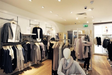 The White Company, Stamford - wooden floor and clothing displays, white walls