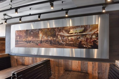 Shake Shack, Leicester Square - metal photo on wall showing outdoor seating at a Shake Shack