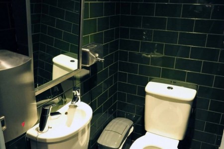 Shake Shack, New Oxford Street, London - toilet with green tiling and chrome details
