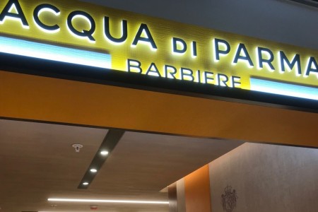 Acqua Di Parma Barbiere installation shopfront with logo