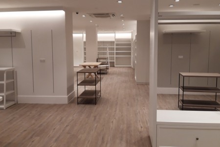 The White Company, Windsor - wooden floor and white shelving and shop fittings 