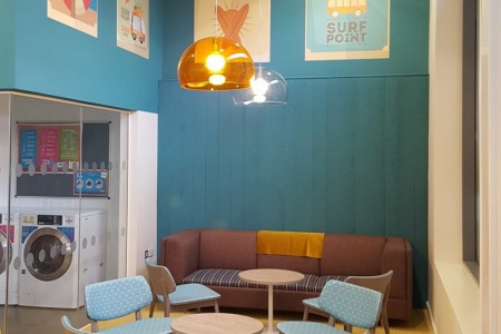 One of the many relaxation areas within Astor House, with a colourful theme and unique lighting
