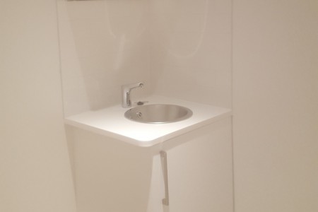 Bespoke modern white sink installed by Oakwoods for Auerbach & Steele