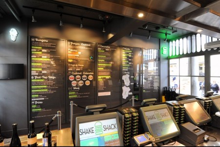 Shake Shack, Covent Garden - till area with black walls and menus, POS systems