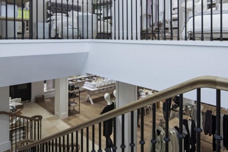The White Company, Norwich - view over the wooden handrail, bespoke wooden flooring and mannequins 
