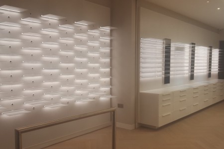 Bright lighting with white modern cabinets, by bespoke joiners Oakwoods in London