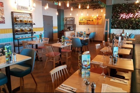 Prezzo, Weston Super Mare - bright tiled walls, wooden chairs and tables, exposed light bulbs